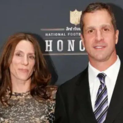 Photo of Alison Harbaugh's father, John William Harbaugh and mother, Ingrid Harbaugh during NFL third honour.